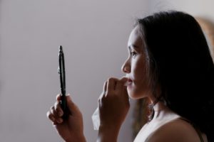 Woman looking in mirror, Safe Haven Counselling, Counselling Surrey BC